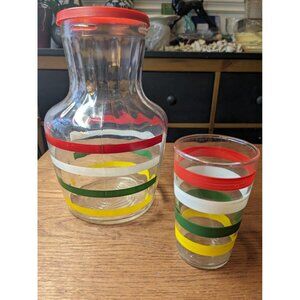 2 pc. 1940s mid century decanter w/glass   red, white, green and yellow stripes.